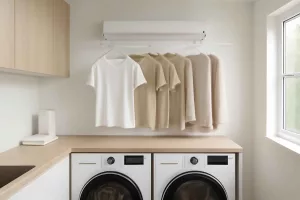 Retractable indoor clothesline installed in a modern small laundry room