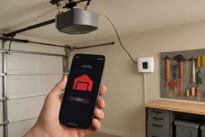 Smart garage door controller installed in a home garage with phone-based remote access and status alerts